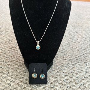 Blue topaz and silver necklace and earrings.